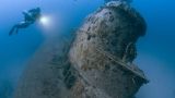 Divers of the Ministry of Emergency Situations examine the flooded The Kara Sea nuclear submarine K-27